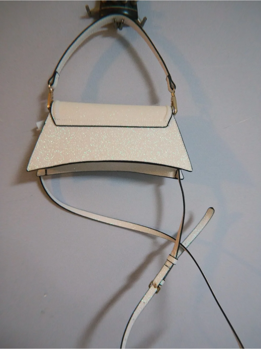 ALDO Akeelax mini bag featuring a sparkling finish and a vibrant iridescent butt
